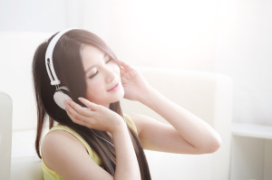 Young woman enjoying the music at home